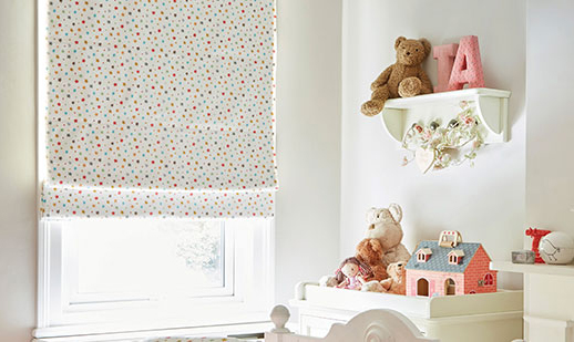 image to show kids room using a patterned roller blind