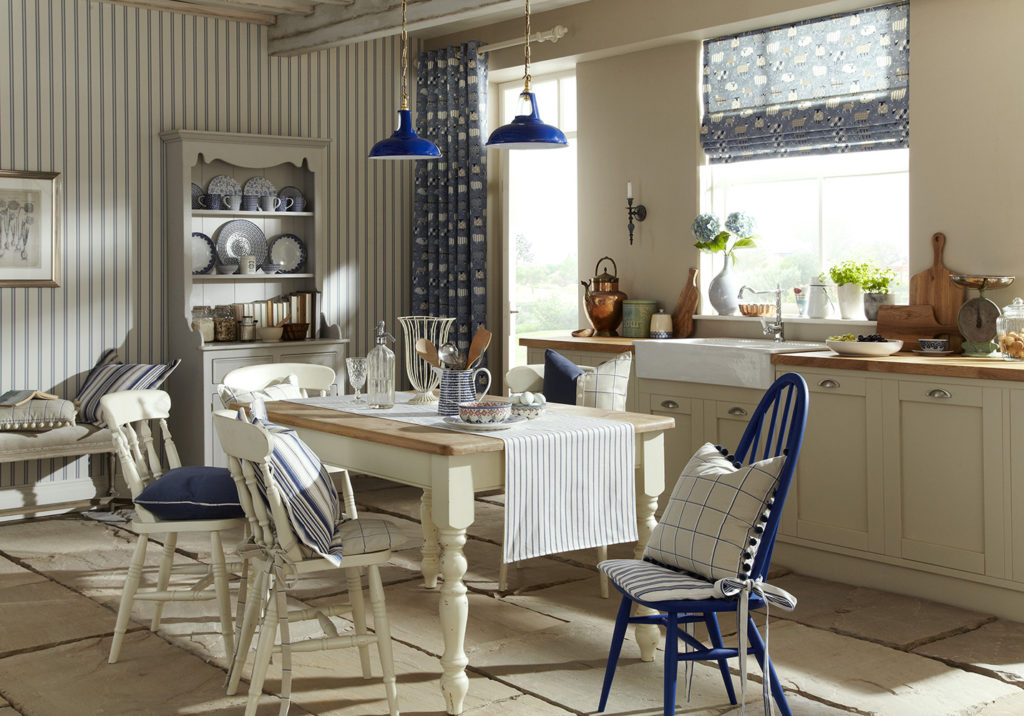 Country cottage kitchen with blue curtains and Roman blinds