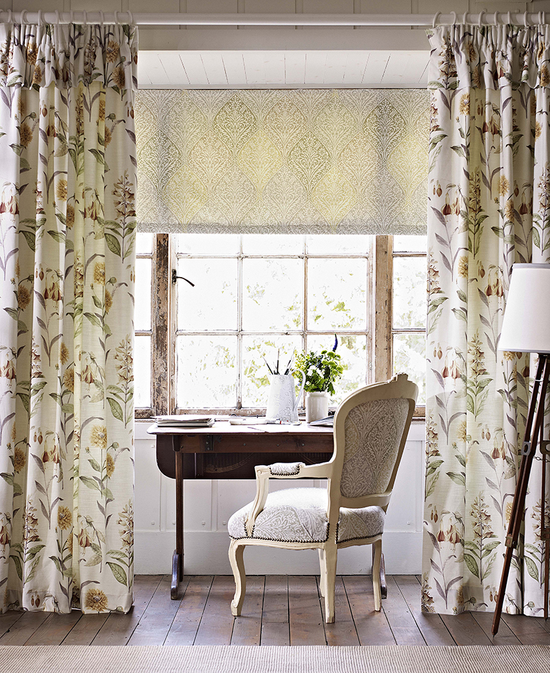 image of chair and table in front of window using a contrast of curtains and blinds 