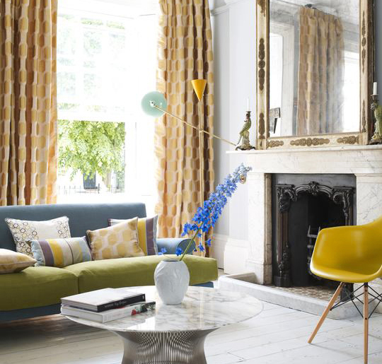 Colourful retro living room with mustard curtains
