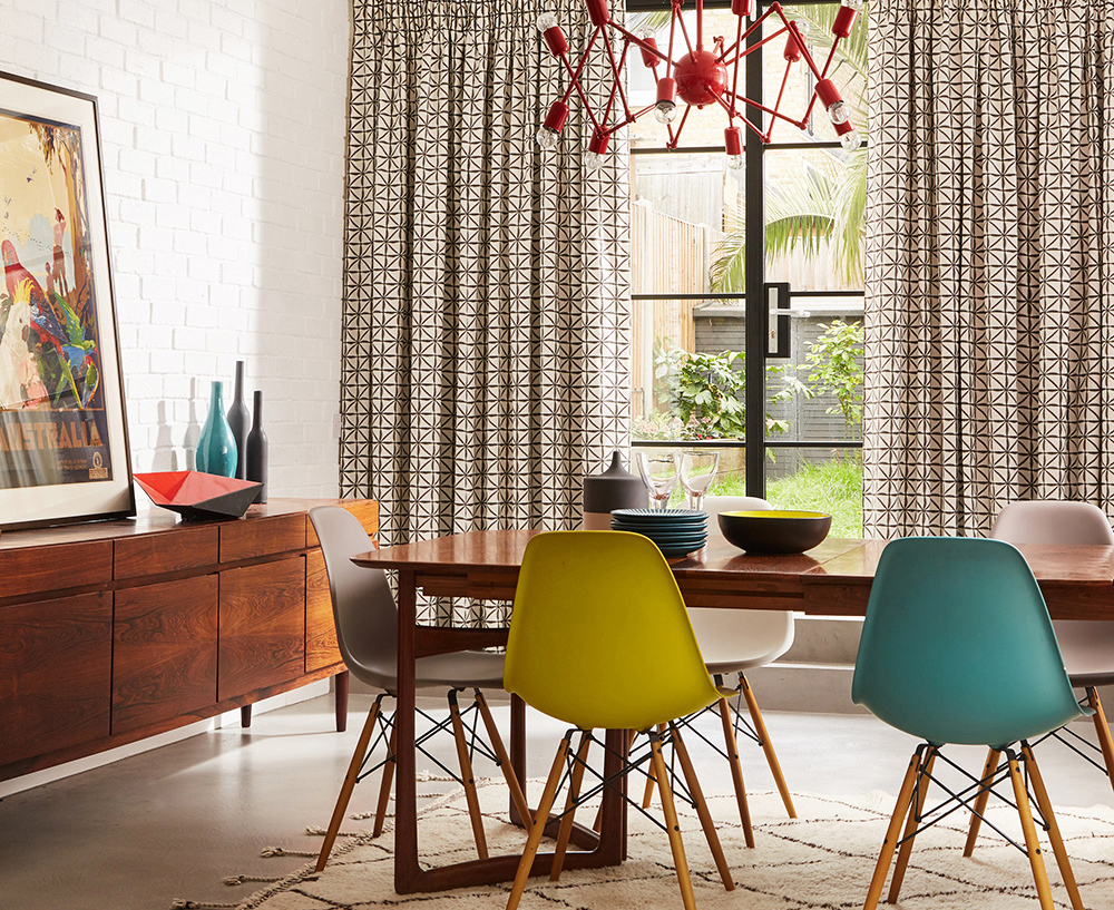 dining room with large window and yellow and Chartreuse colour chairs