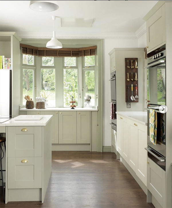 photo of open planned kithen with large window and wooden blinds 