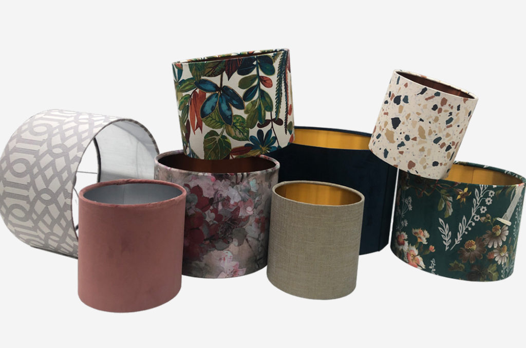 photo of different kinds of metallic lampshades in a pile