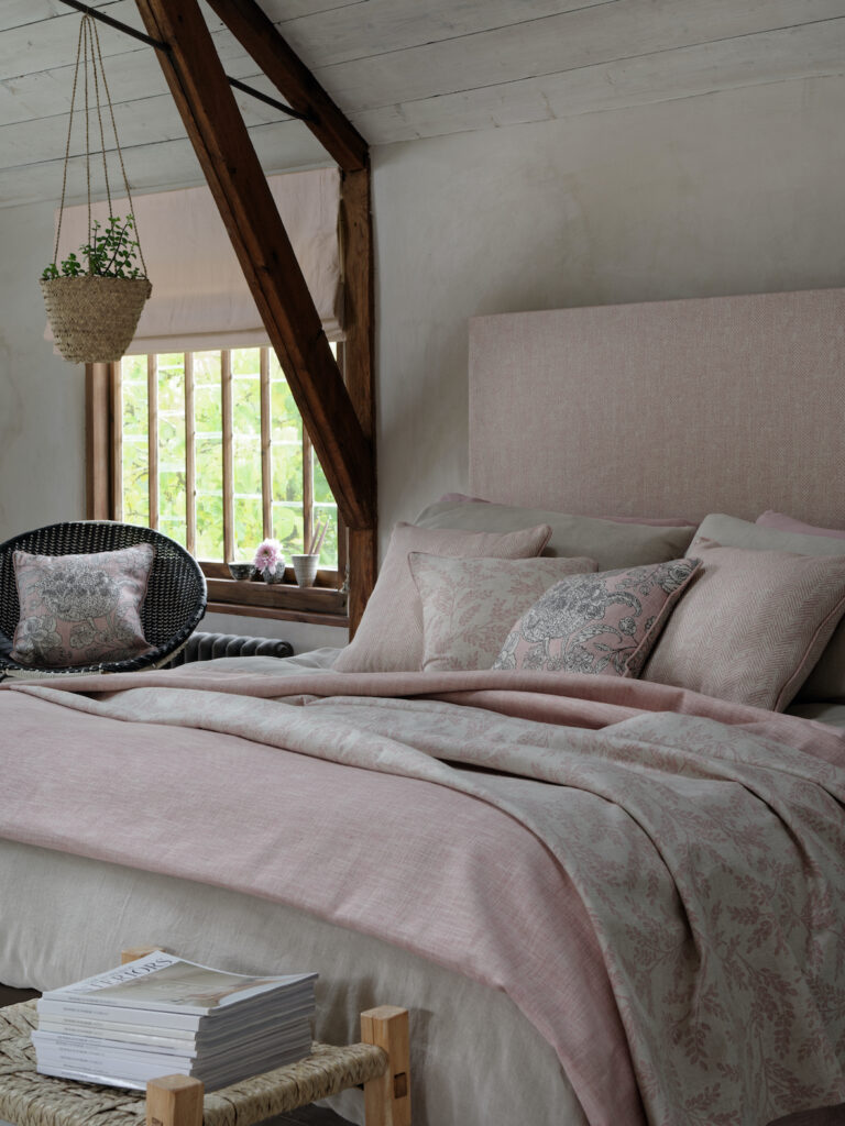 photo to show example of how to use pink roman blinds in a bedroom 
