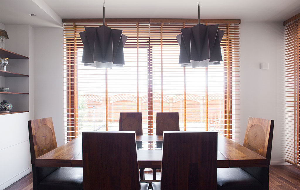 wooden blinds with brown dining room table inspired by the iberian peninsula 