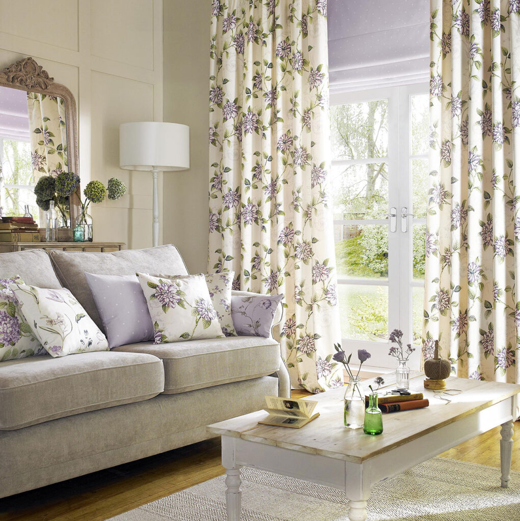 a photo of flora printed curtains and cushion to show how flowers can increase your happiness at home