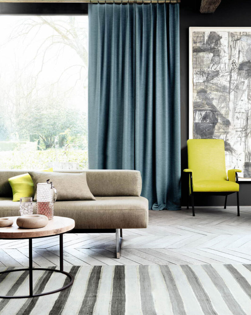 image to show living room layout with stripes and colour to show how to use modernism in interior design 