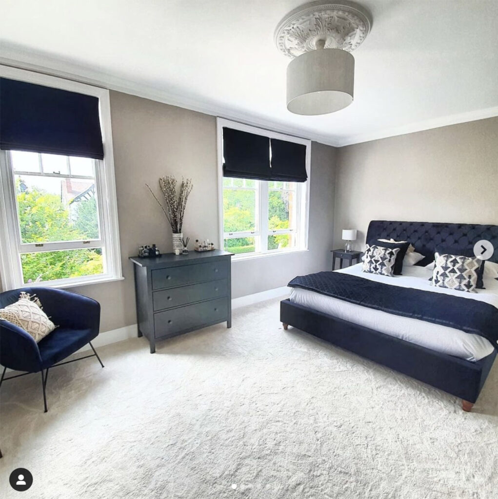 image of social media post to show dark blue roller blinds from blinds direct being used 