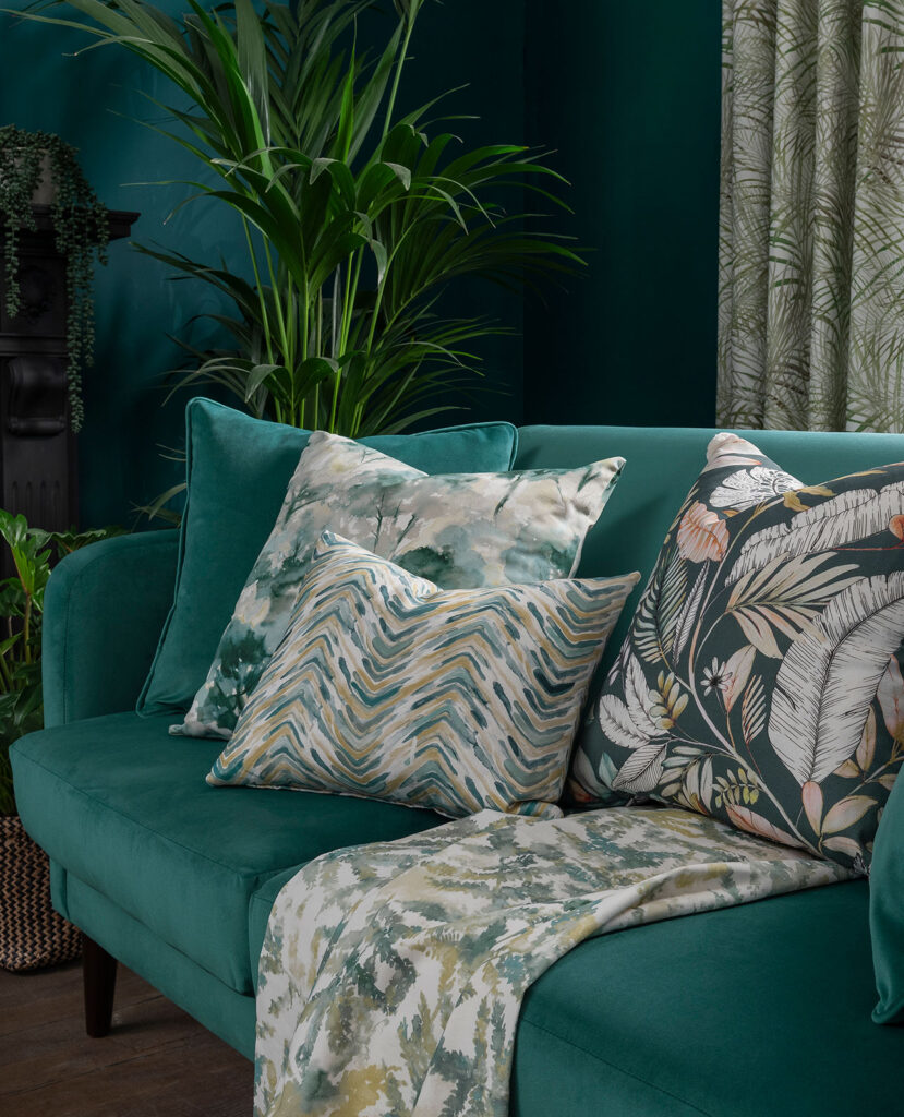 photo of green sofa next to green curtain to show the green colour combination