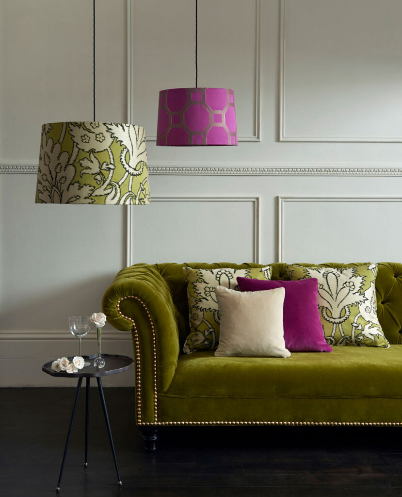 image of moss coloured sofa next to stone wall to show moss and stone as the best colour combinations