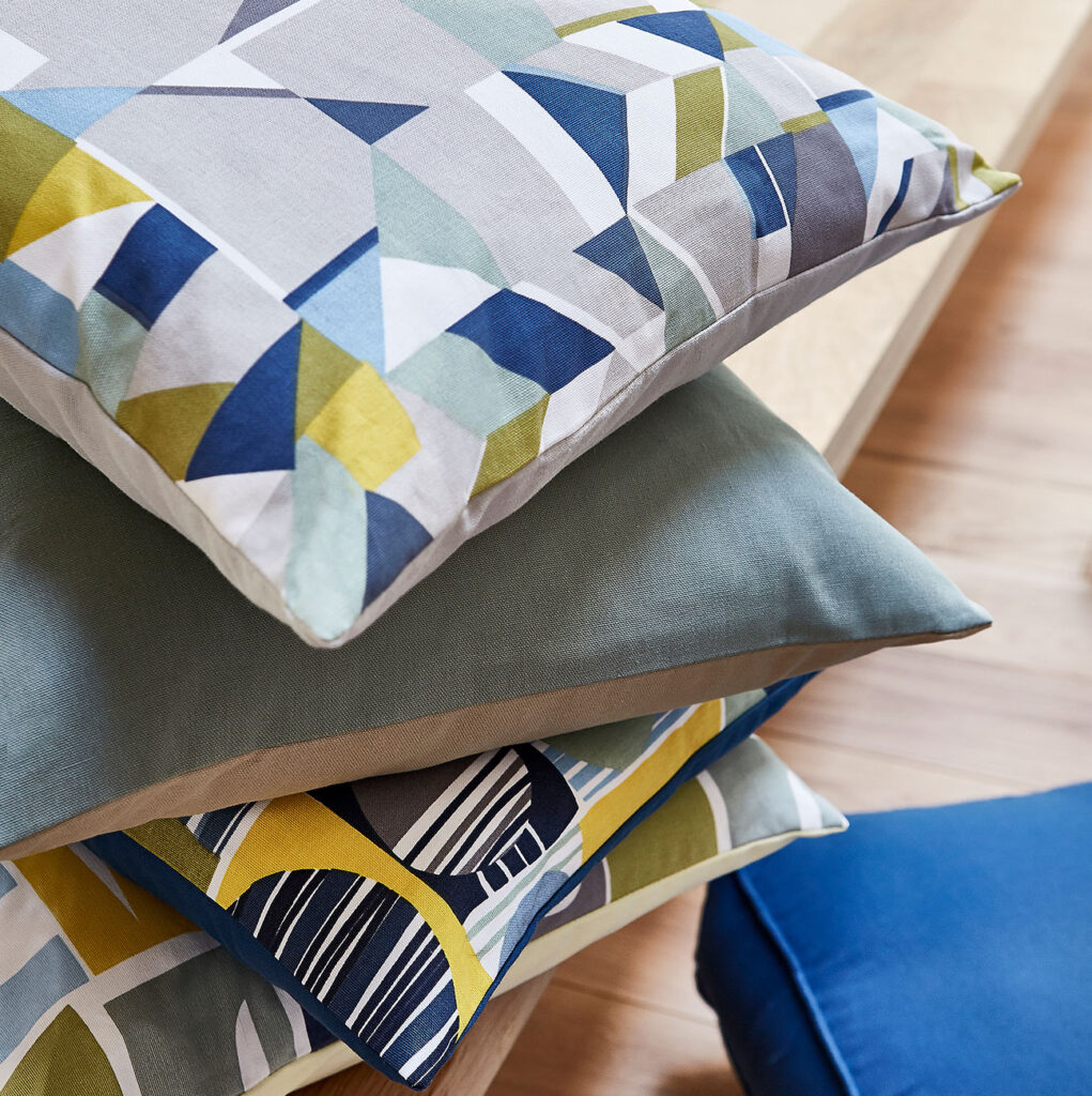 image of three cushions stacked to example of how to decorate your uni room 