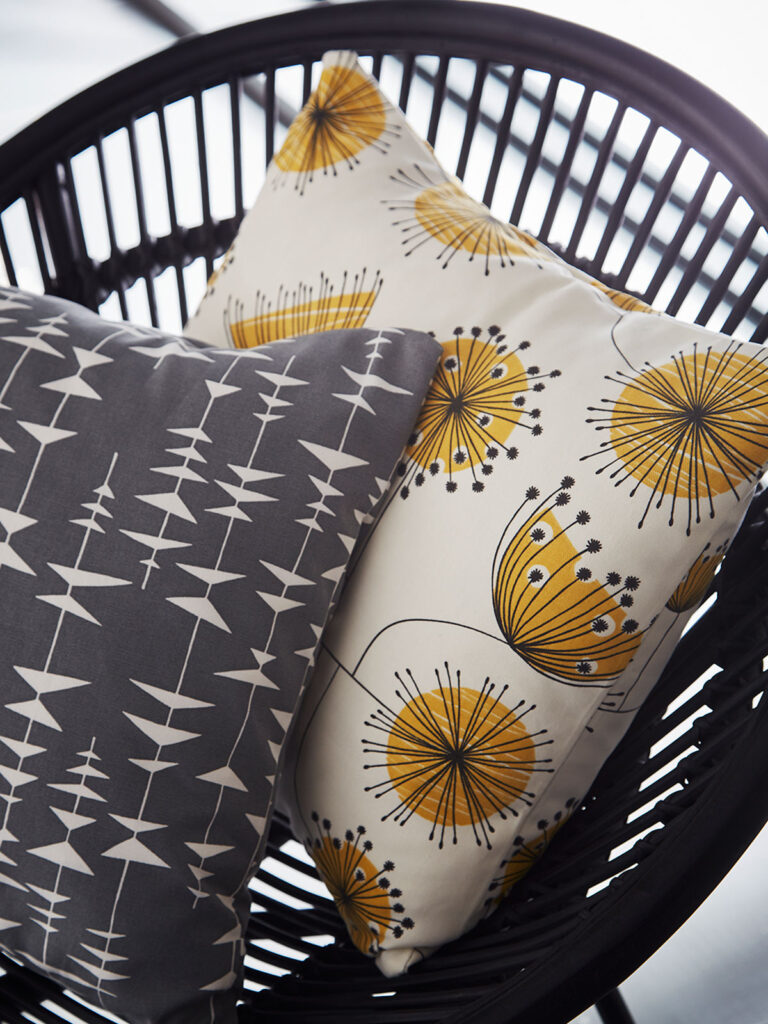 photo of cream and anthracite cushions on top of chair