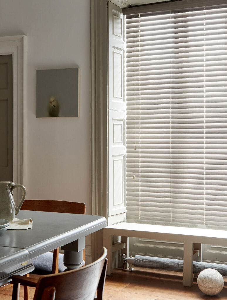 image to show a modern room using wooden blinds on a large window 