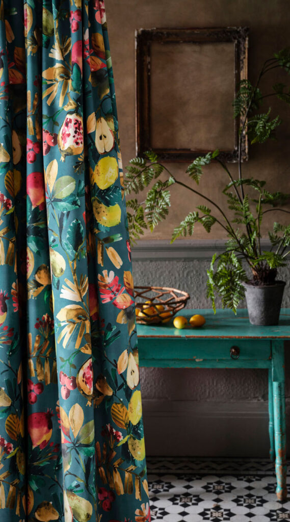 photo of gold and green curtain next to green table