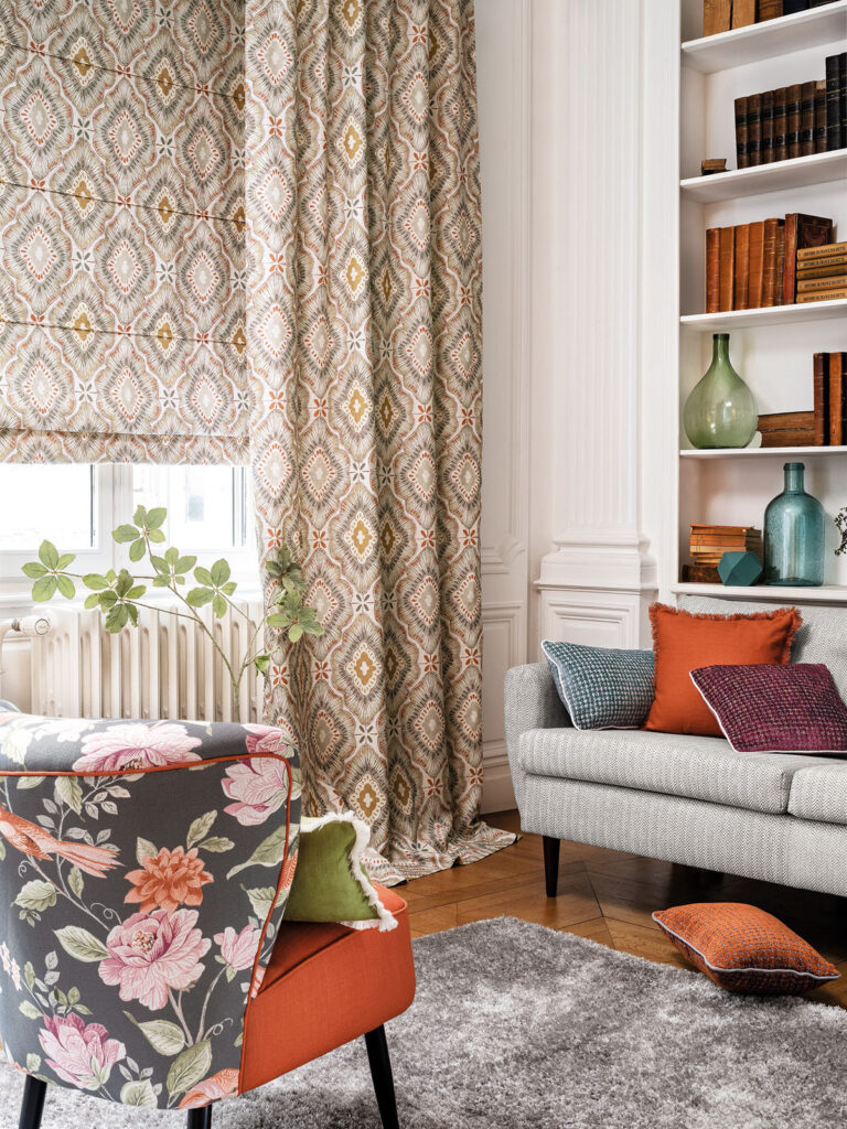 image of room with two sofas and boho style curtain