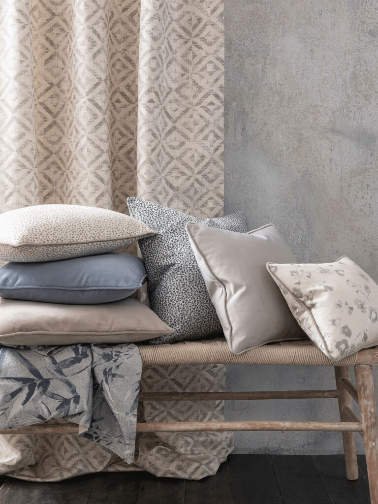 photo of cushions on top of bench next to window to show examples of accessories to use in brazil interior design