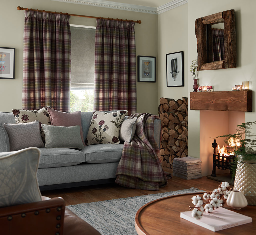 image of living room decorated for christmas with tartan throws and curtains 