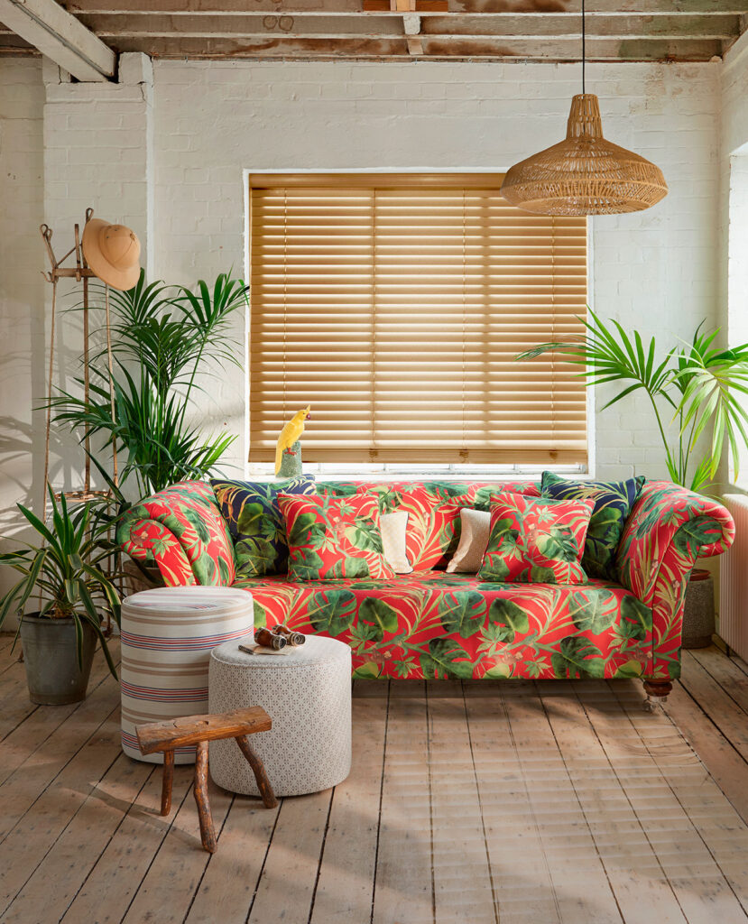 image of living room with house plants and wooden shutters influenced by the equatorial region 