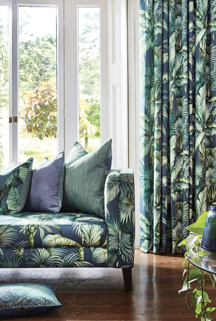 image of blue patterned sofa and matching curtain in living room 
