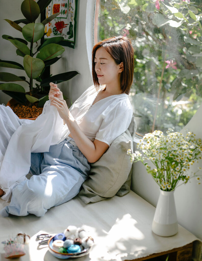 image of woman showing how to recycle old curtains