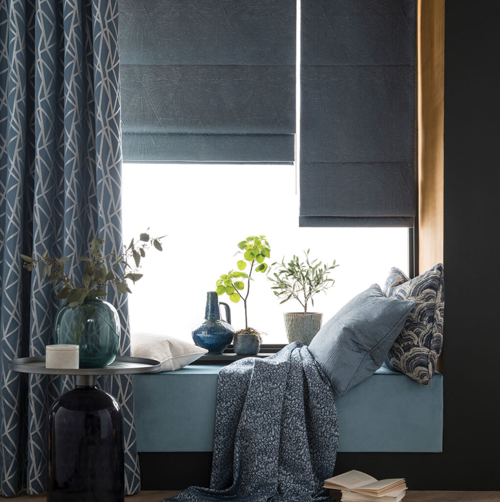image to show how a blackout roman blind can benefit room in your home 