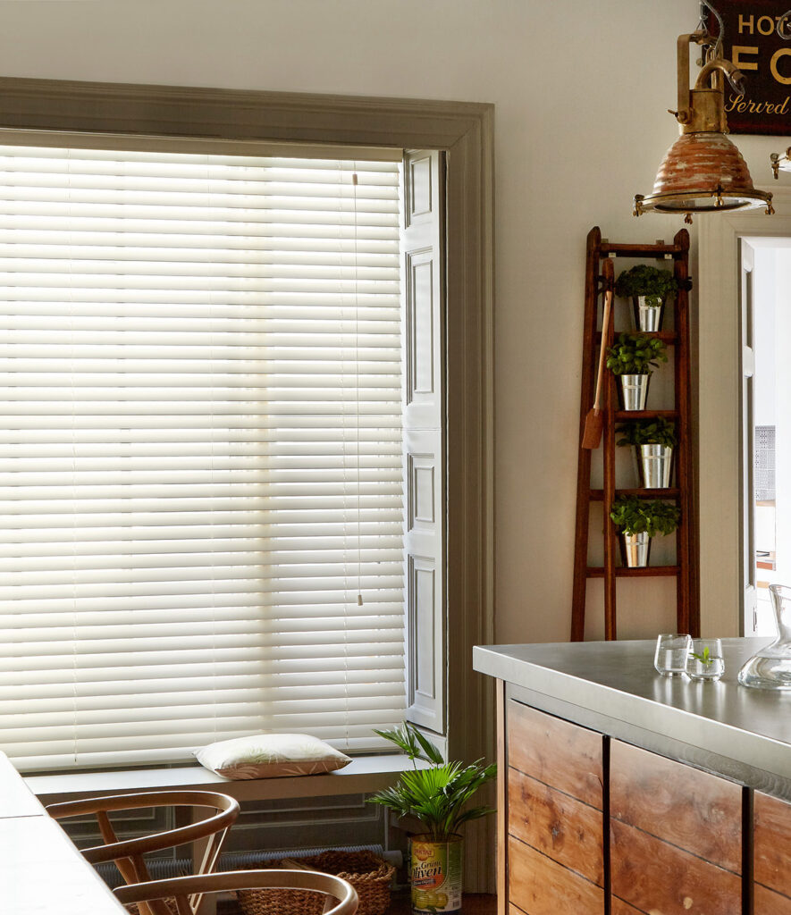image to show what a type of faux wood blind looks like in a kitchen 