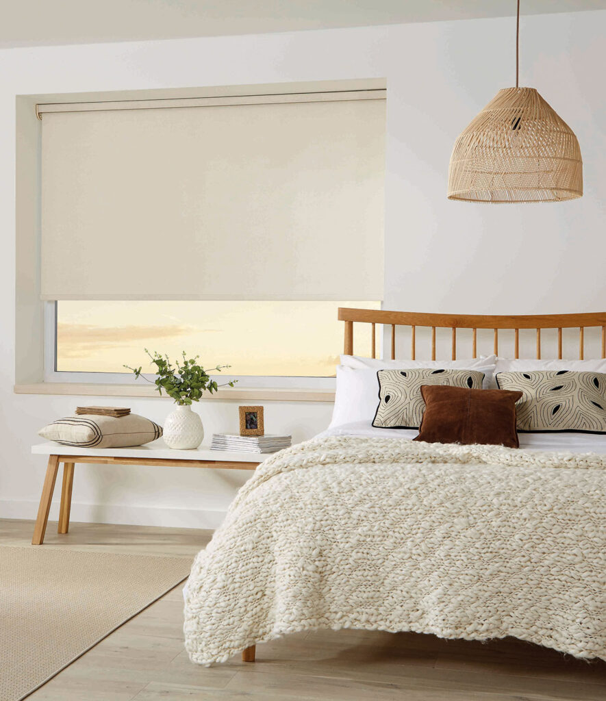 image of a roman blind in a bedroom with a linen fabric style look