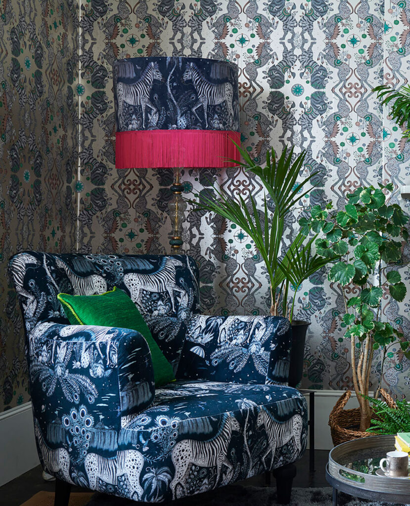 image of blue chair with animal print next to lamp