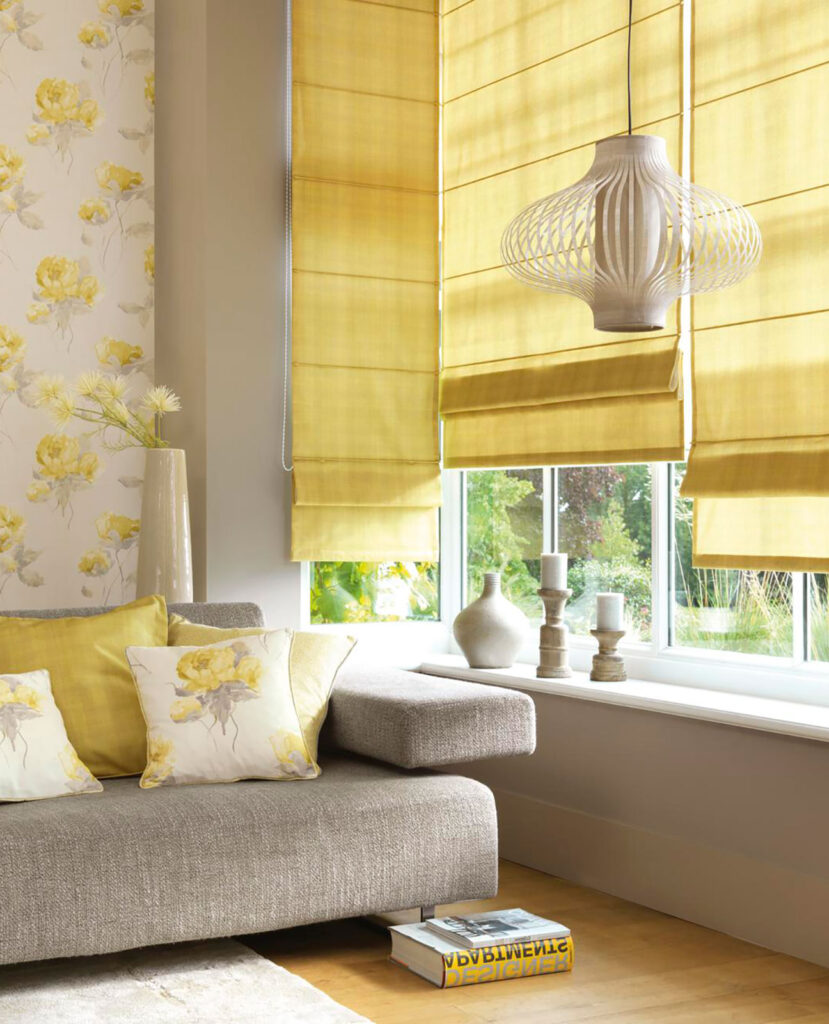 photo of brown sofa next to window with pastel yellow blinds fitted 