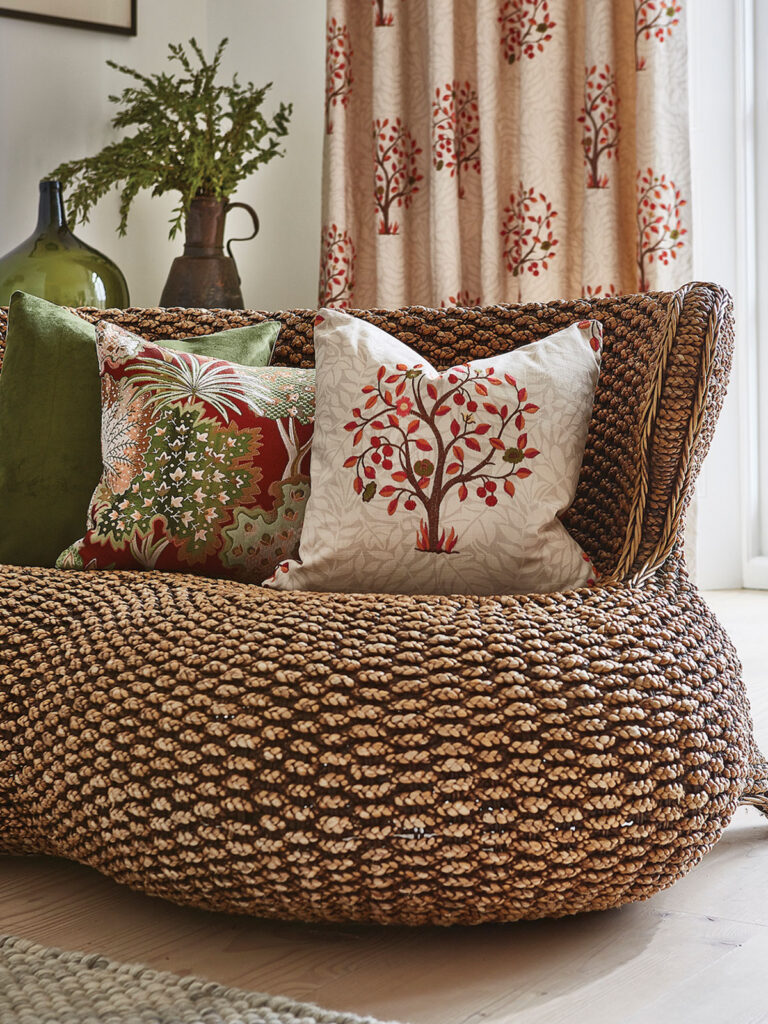 photo of wicker chair with cushions on top 