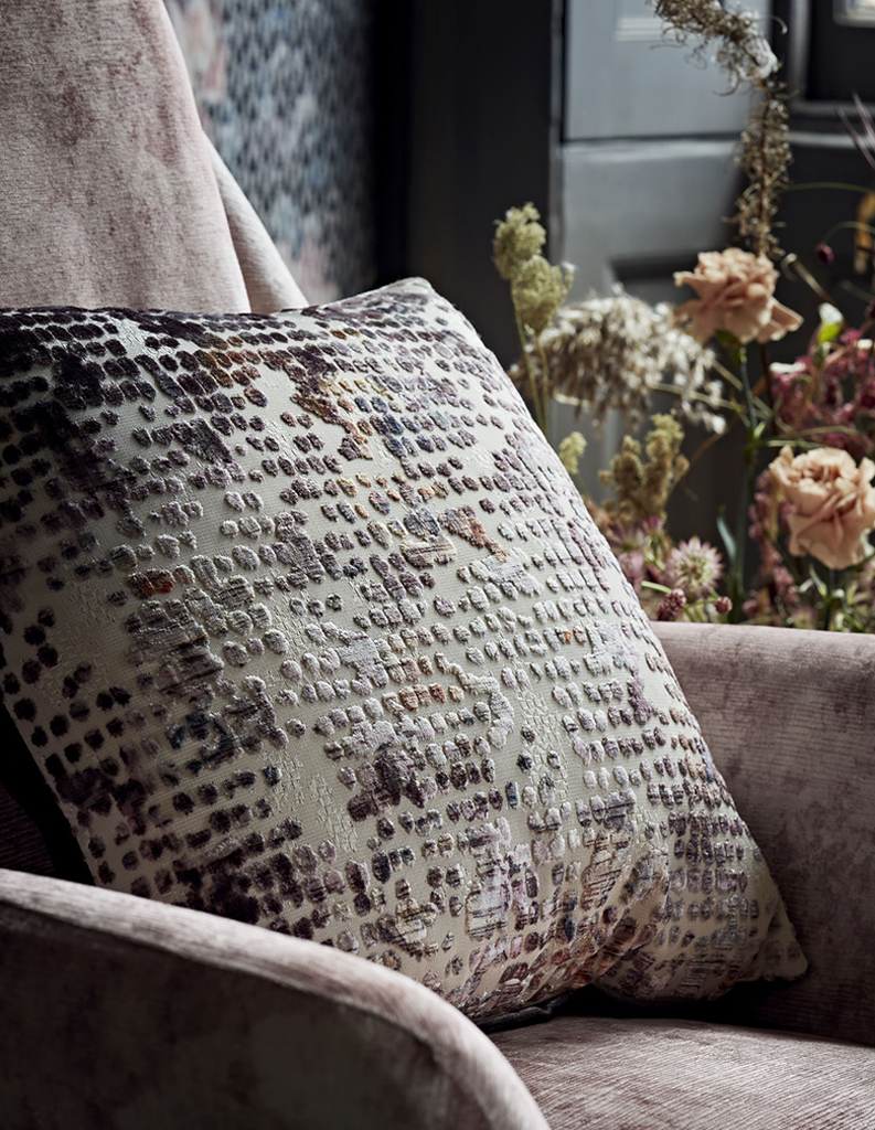 close up image of a textured cushion on chair 