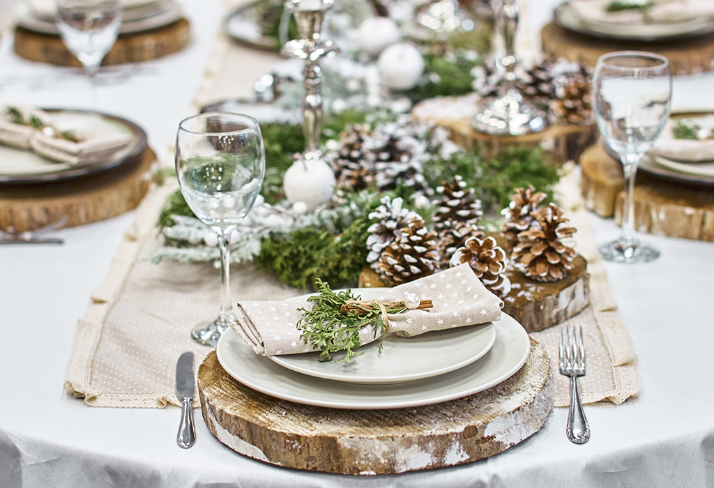 a photo of an table set for christmas dinner 