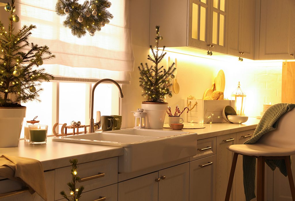 a photo of a kitchen with Christmas decorations up