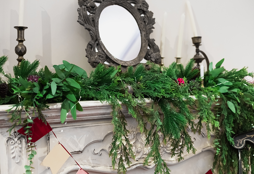 an image of a mantlepiece that has been decorated for Christmas