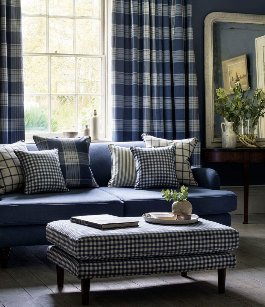 image of blue gingham curtain on large window next to sofa 