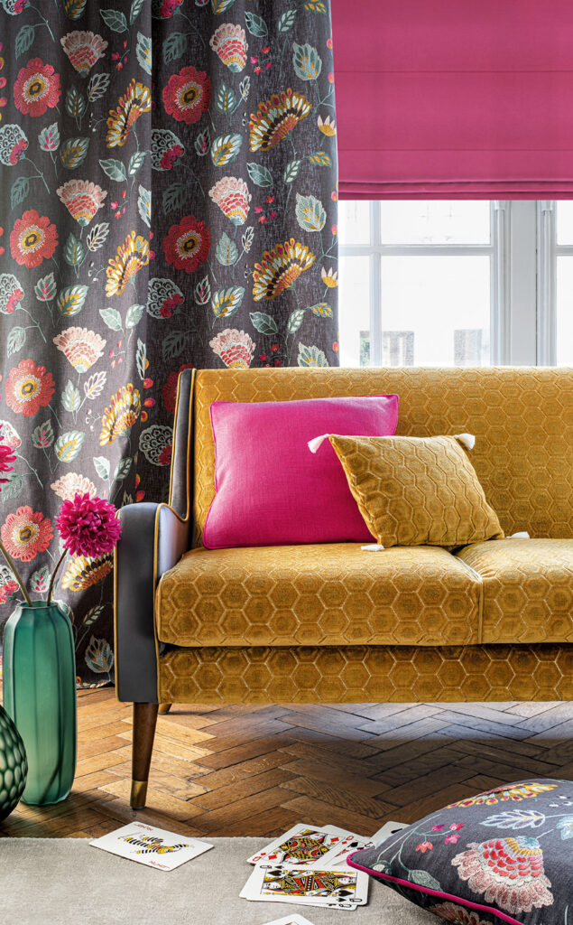 room set image of living room with yellow sofa and hot pink coloured roman blind 