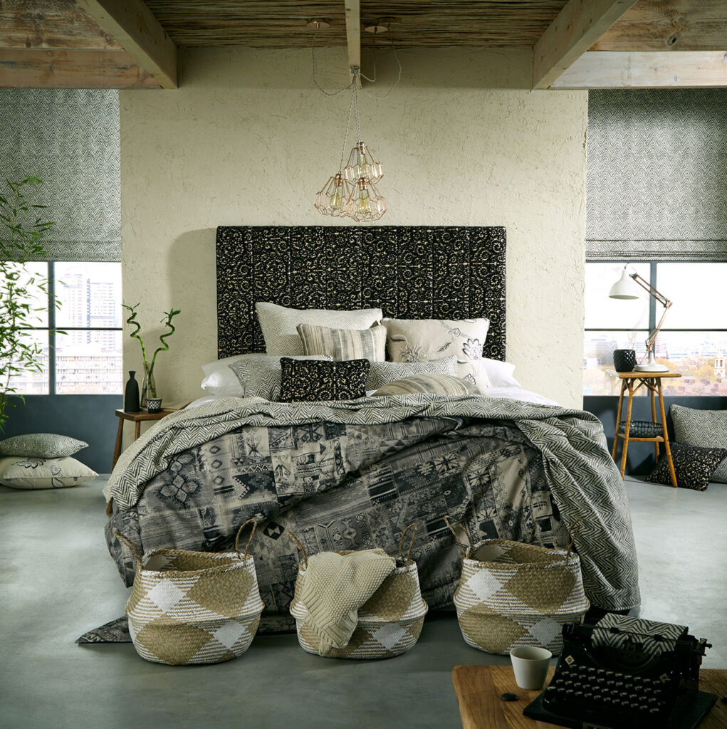 image of a bedroom with a black and white coloured interior 