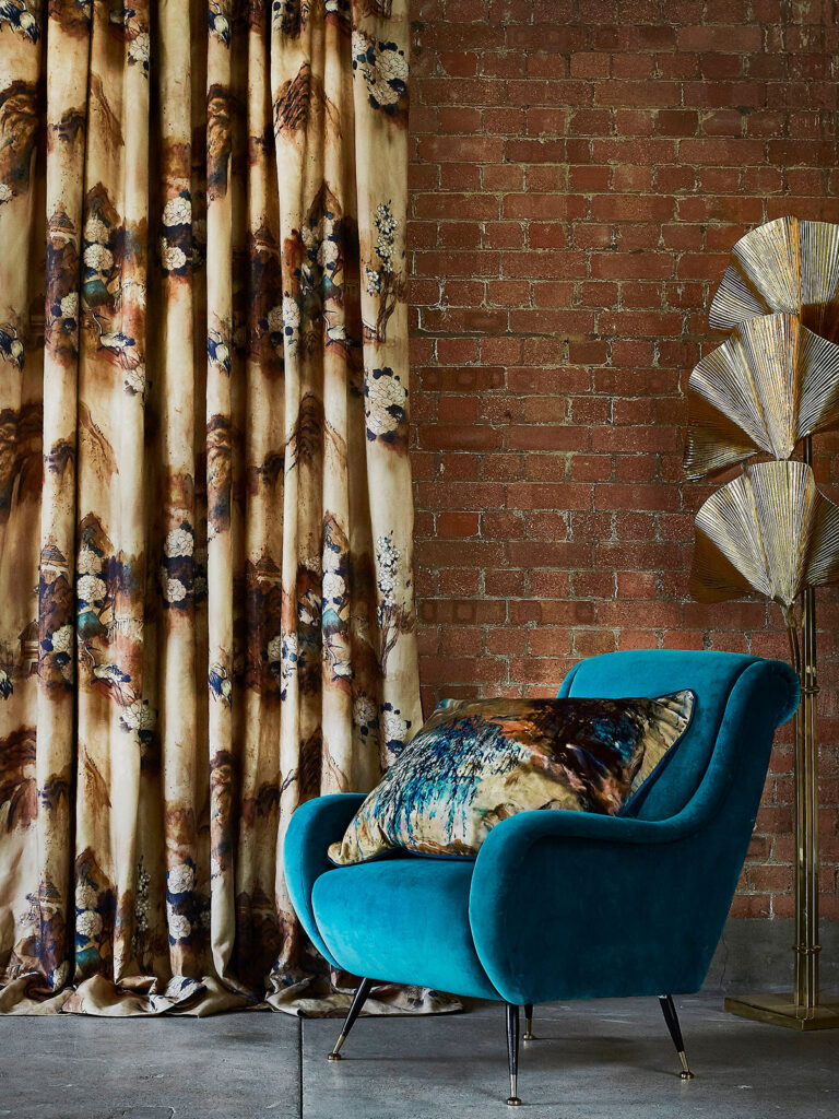 photo of blue chair next to chinoiserie decor