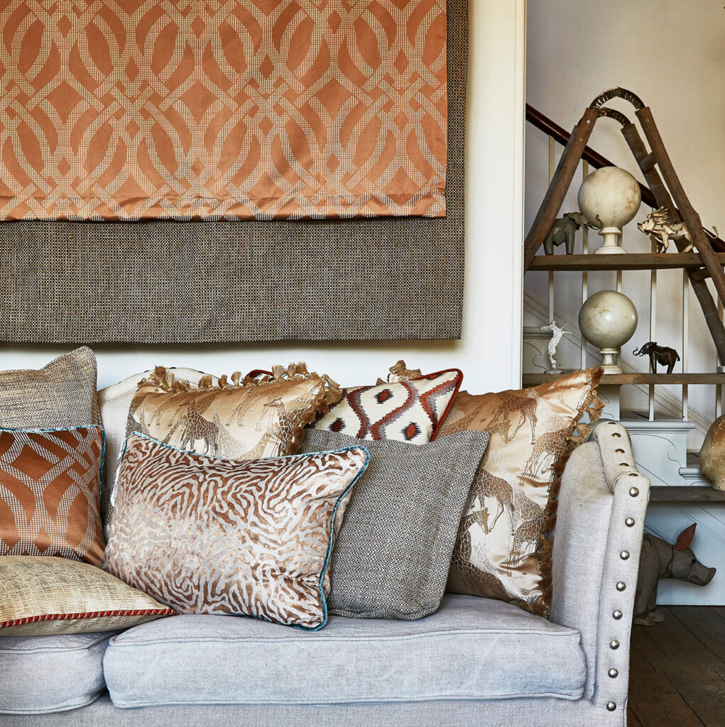 a kitchen table themed with burnt sienna orange next to window