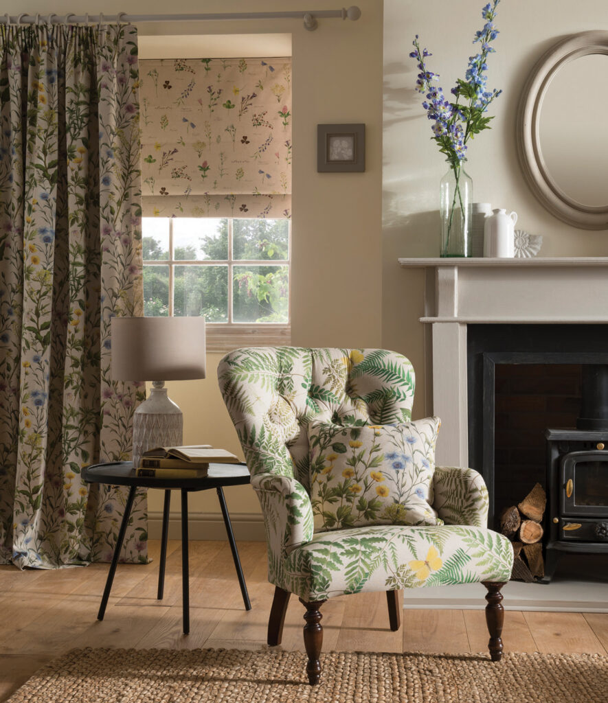 image of floral chair in living room in front of window with green curtain