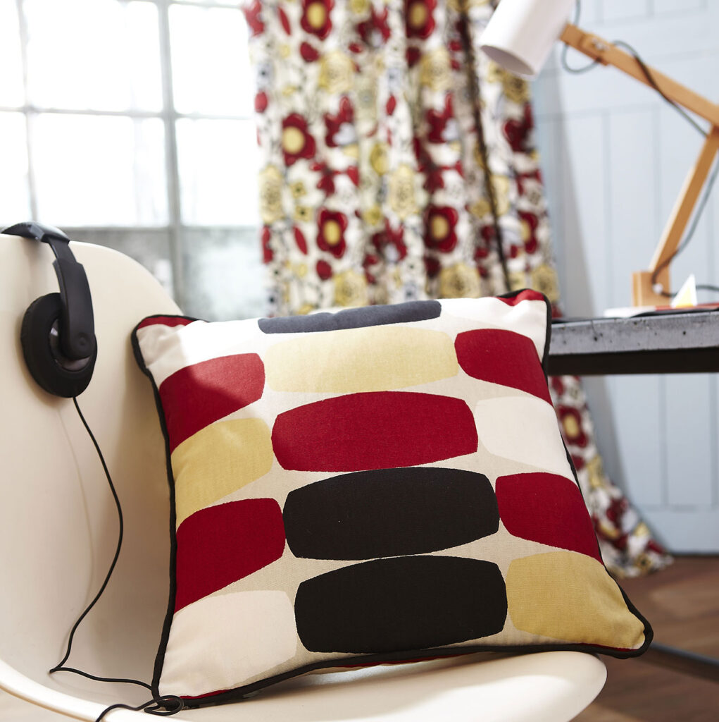 image of red cushions on white chair in home office