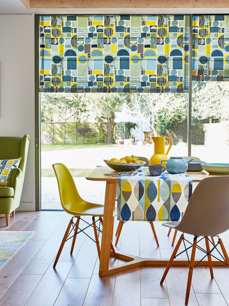 A colourful statement blind in a kitchen.