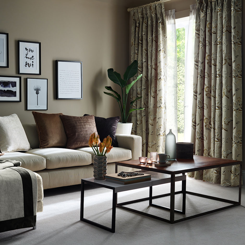 A living room featuring warming, latte colours.