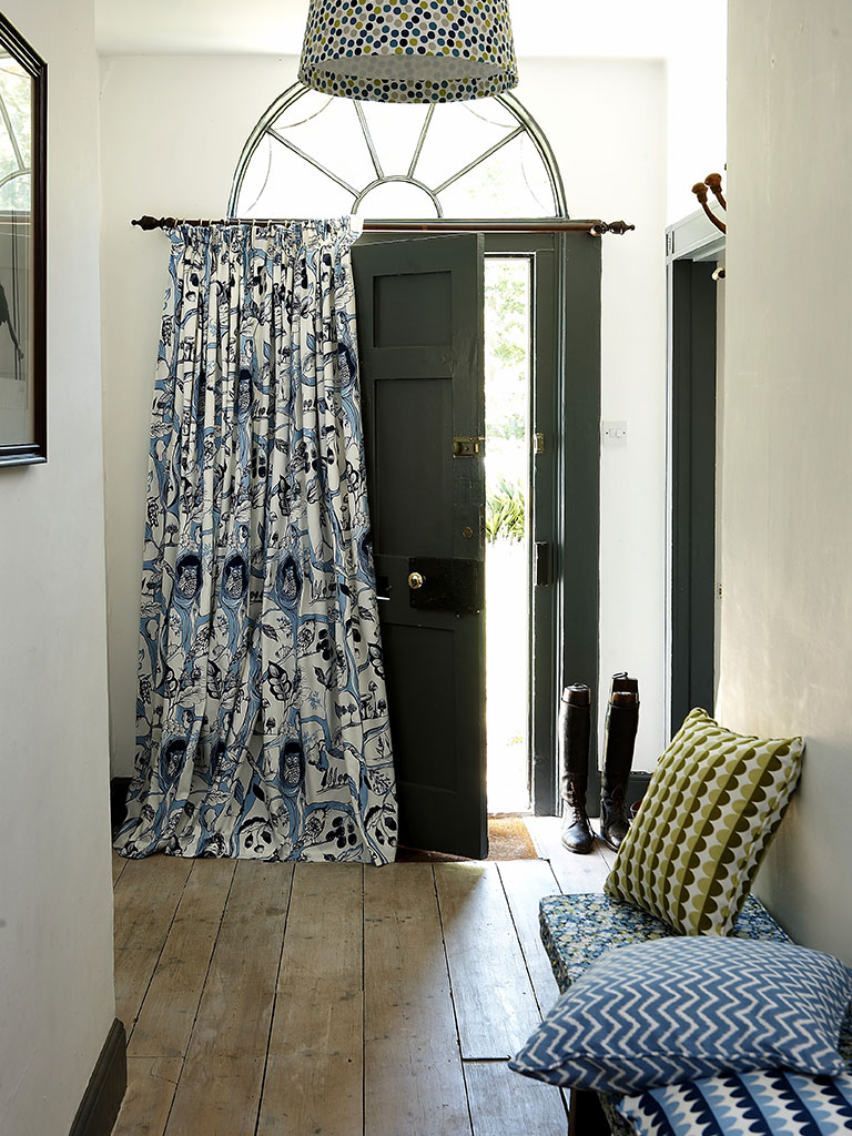 An example of a blue door curtain in a hallway.