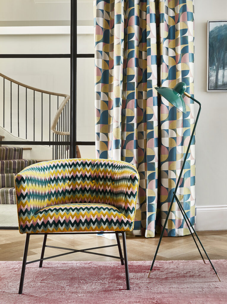 Retro pattern curtains and a chair