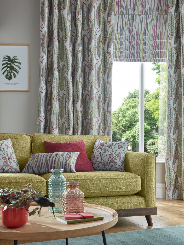 A mustard sofa in a colourful living room 
