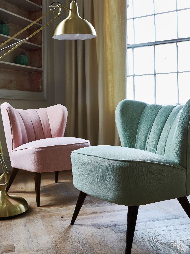 Pink and mint comfy chairs in a living room 