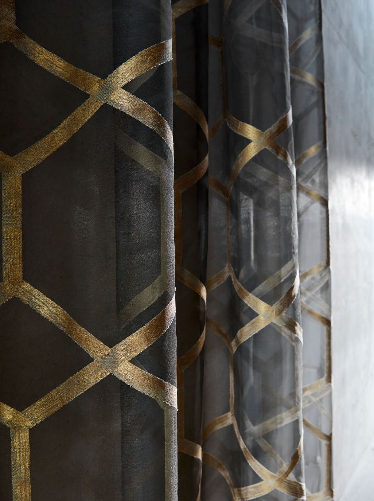 black curtains with a gold pattern