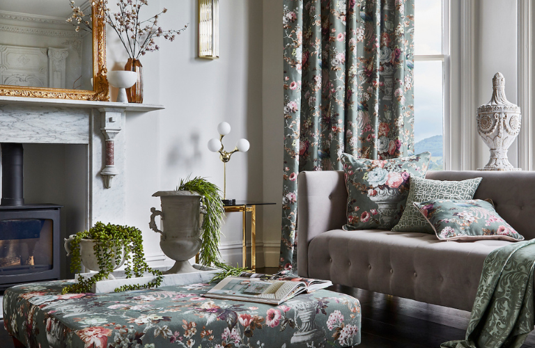 A neoclassical living room with floral curtains and cushions.