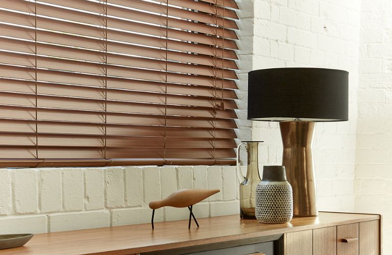 A table with accessories and a smart wooden blind